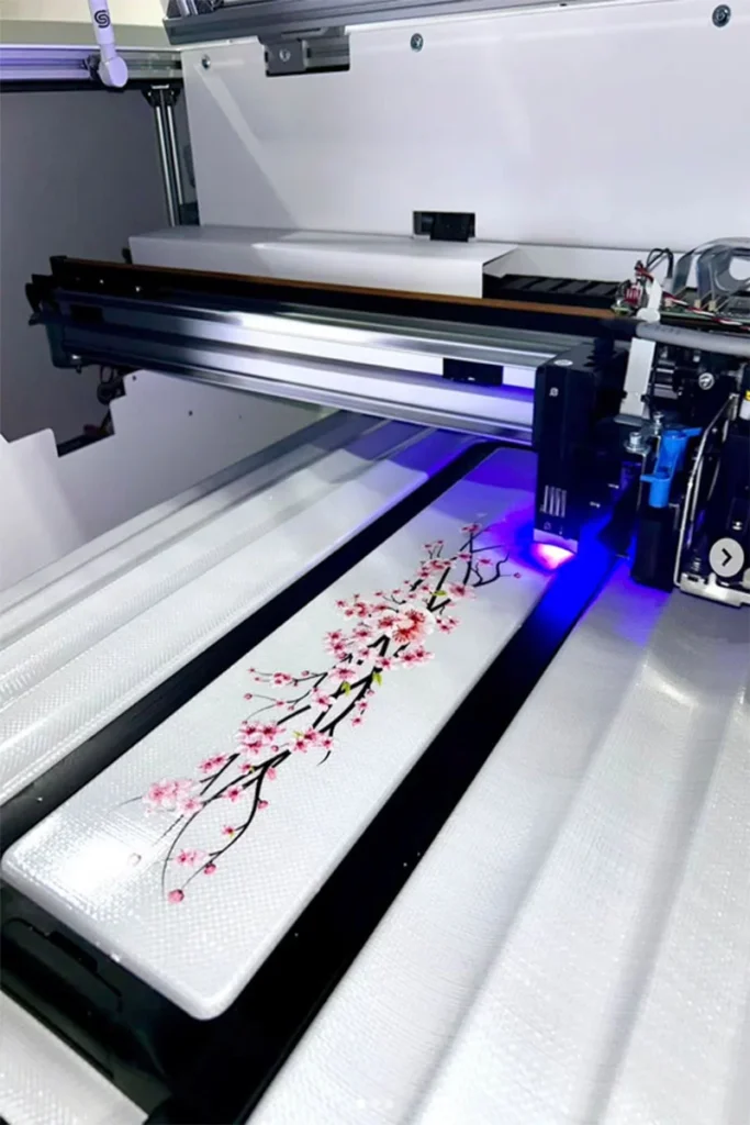 Azon digital printer applying high-precision floral branch designs to industrial surfaces