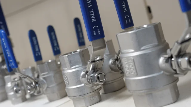 Close-up of stainless steel ball valves with blue pad-printed handles, clearly showing "BALL VALVE" and "ON/OFF" markings, demonstrating durable industrial printing by Automarkco.com
